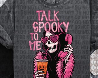 May include: Dark gray sweatshirt with a graphic of a skeleton wearing heart-shaped sunglasses and a pink boa, holding a phone and a drink. The text "TALK SPOOKY TO ME" is in pink. Halloween-themed apparel.
