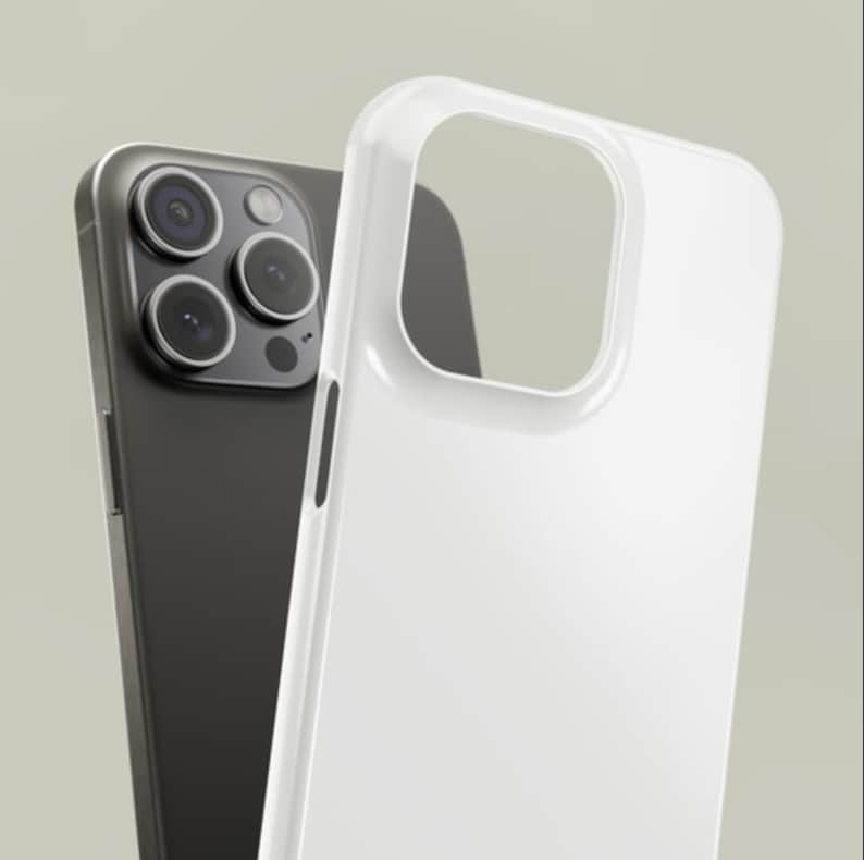 May include: A black smartphone with a triple-lens camera is positioned behind a clear, white phone case. The case is made of a glossy material and has a cutout for the camera. The phone and case are set against a neutral background.