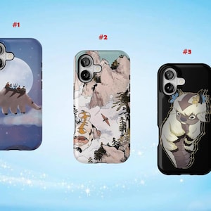 May include: Three phone cases with unique designs. The first case is blue with a cartoon bison flying in front of a full moon. The second case has a mountain landscape with a bison and a bird. The third case is black with a cartoon bison.