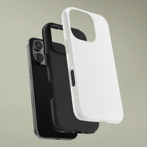 May include: A black smartphone with a black phone case and a white phone case. The phone and cases are layered, showcasing the design and fit. The cases have cutouts for the camera and buttons.