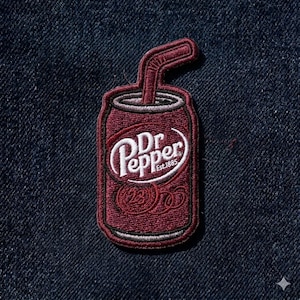 May include: Embroidered patch featuring a Dr. Pepper soda can design. The patch is primarily burgundy with white lettering and a white outline. The can includes a straw and the text "Dr Pepper Est.1885".