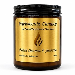 May include: A brown glass candle jar with a black screw-top lid and a gold label. The label features the text Wickscentz Candlez, All Natural Soy/Coconut Wax Blend, Black Currant & Jasmine, Hand Poured in Rochester NY, and wt. 9oz.