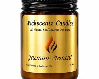 May include: A 255g amber glass jar candle with a black screw-top lid. The gold label features the text Wickscentz Candlez, All Natural Soy/Coconut Wax Blend, Jasmine Element, and Hand Poured in Rochester NY, along with a stylized flame icon.
