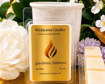 May include: A clear plastic clamshell package containing off-white wax melts. The gold label features a flame icon and text reading Wickscentz Candlez, Gardenia Tuberose, Soy Melts, Wt. 85g, and Hand Poured in Rochester, NY.