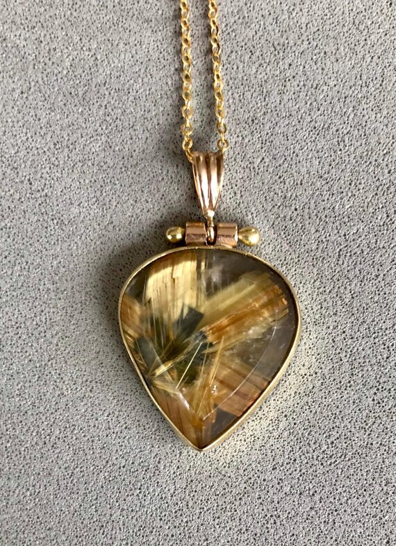 Rutilated Quartz in 18k gold pendant