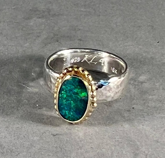 Opal doublet ring with gold on silver