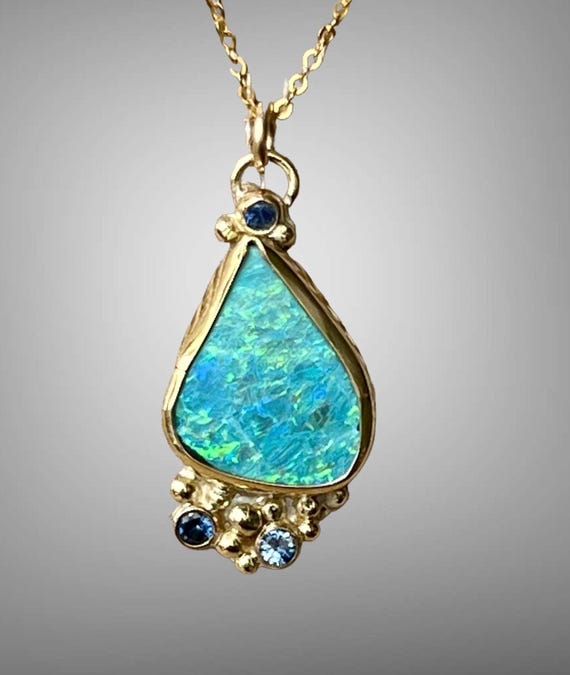 Lighting Ridge Opal doublet and sapphire in 18k gold pendant