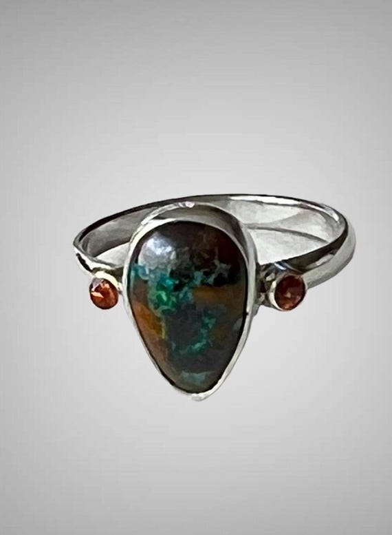 Boulder opal with orange sapphire ring