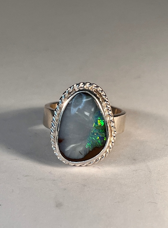 Blue Grey with a slice of green flash Opal ring