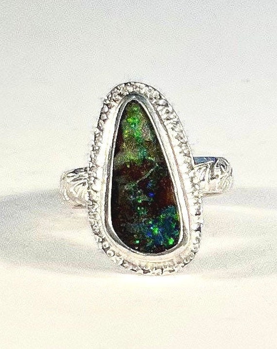 Flashes of green in this Boulder Opal ring