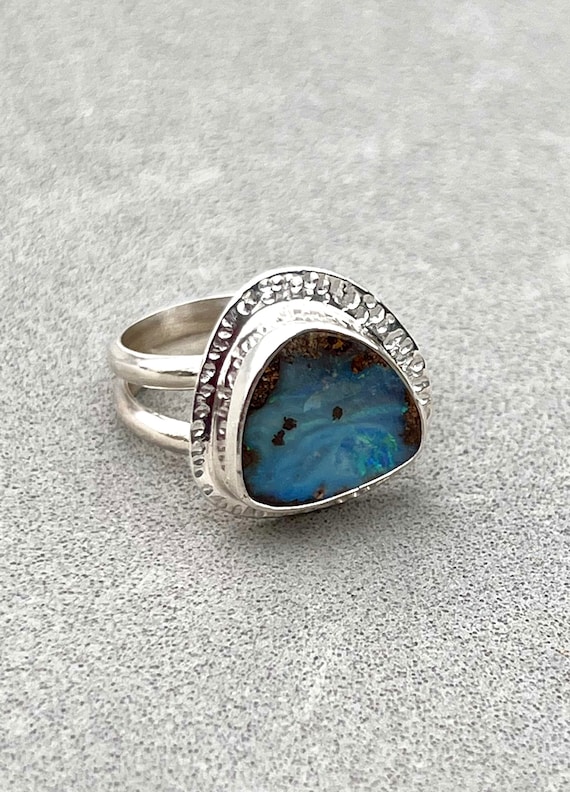 Pretty blue Boulder Opal on a split band ring