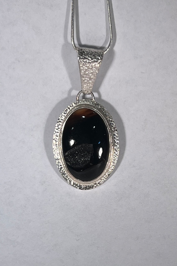Black onyx with druzy on a textured frame