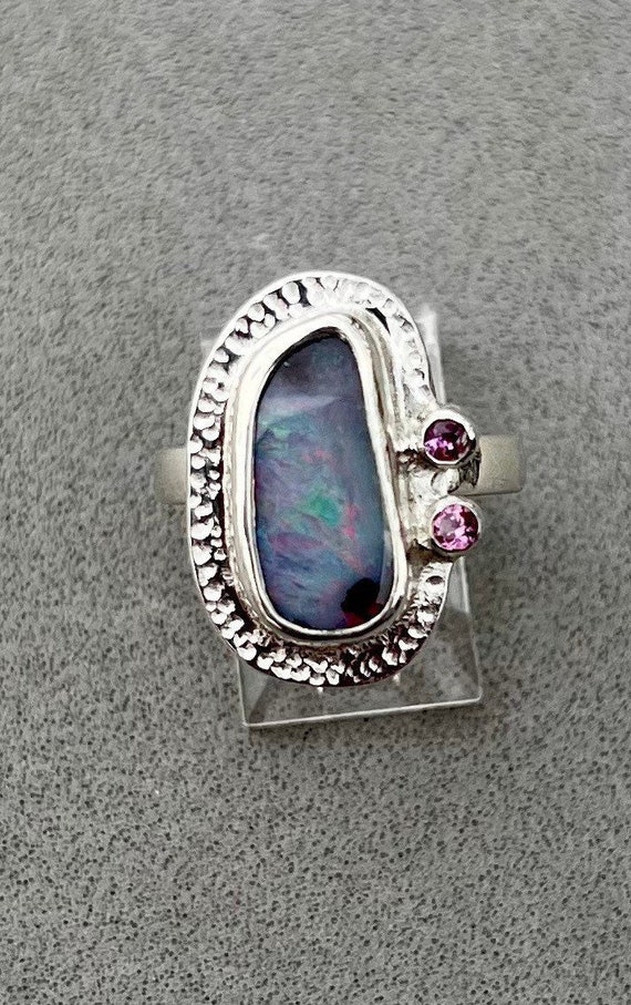 Framed Australian Boulder Opal with sapphire ring