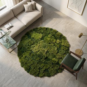 May include: A circular rug featuring a textured, three-dimensional surface composed of various shades of green moss. The rug has an organic, uneven edge and a dense, layered appearance that mimics the look of natural forest floor vegetation.
