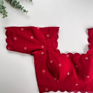 Red Scallop blouse with stylish edges. Perfect for sarees, weddings, or festive wear. Custom sizes available. Ready to wear Blouse