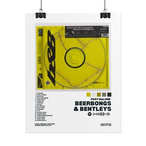 May include: A poster featuring the album art for Post Malone's "Beerbongs & Bentleys." The design includes a yellow CD case with barbed wire, the album title, tracklist, and release information. The poster is held by black clips.