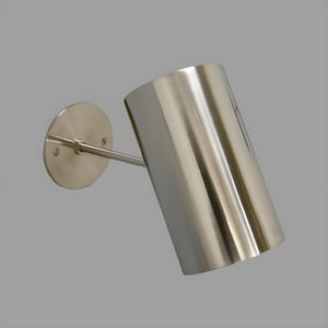Bring timeless elegance to your interior with this handcrafted Mid-Century Brass Wall Sconce. Inspired by 1950s design, it features clean lines, a satin nickel finish, and soft ambient lighting—perfect for bedrooms, hallways, or reading nooks. Made from solid brass and built to last, this sconce blends vintage charm with modern craftsmanship. Hardwired with E12/E14 socket. Bulb not included.