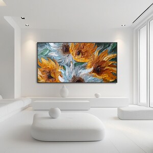 May include: A large, rectangular oil painting featuring close-up sunflowers in shades of yellow, orange, and white. The textured brushstrokes create a three-dimensional effect. The background is a mix of green and blue.