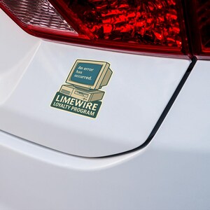 May include: A sticker featuring a retro computer with the text "An error has occurred." and the words "LIMEWIRE LOYALTY PROGRAM" in green. The sticker is affixed to a white car.