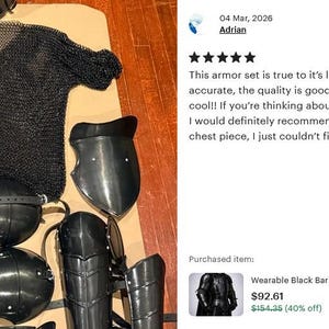 May include: A black knight armor set, including a chainmail shirt, helmet, shoulder guards, and leg and arm protection. The armor is displayed on a neutral surface. The image includes text from a customer review.