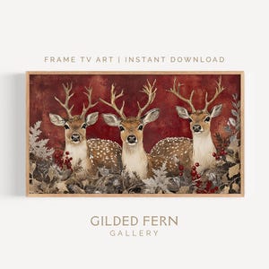 May include: A framed print featuring three deer with large antlers, set against a deep red background. The deer have brown fur with white spots and are surrounded by foliage and berries. The text "FRAME TV ART | INSTANT DOWNLOAD" and "GILDED FERN GALLERY" are visible.