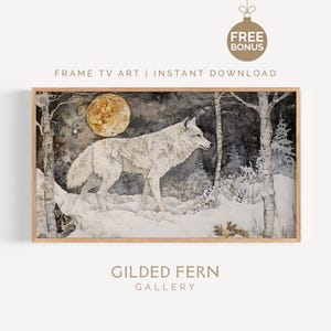 May include: A framed art print featuring a white wolf in a snowy forest under a full moon. The artwork has a watercolor style with a neutral color palette. The text "FRAME TV ART | INSTANT DOWNLOAD" and "GILDED FERN GALLERY" are visible.