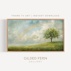 May include: A framed digital art print featuring a landscape with a rainbow, a tree, and a grassy field. The artwork has a soft, painterly style with text that reads "FRAME TV ART | INSTANT DOWNLOAD" and "GILDED FERN GALLERY".