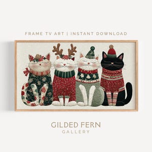 May include: A framed print featuring four whimsical cats dressed in festive holiday attire. The cats are adorned with sweaters, hats, and decorative accents. The text "FRAME TV ART | INSTANT DOWNLOAD" and "GILDED FERN GALLERY" are visible.