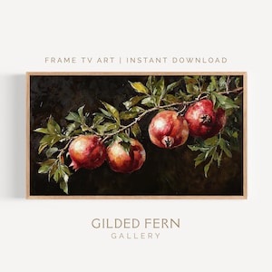 Peut inclure: Impression d'art encadrée représentant une branche avec quatre grenades mûres et des feuilles vertes sur fond sombre. L'œuvre est intitulée "FRAME TV ART | INSTANT DOWNLOAD" et "GILDED FERN GALLERY".