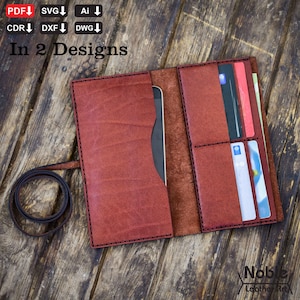 May include: Open, reddish-brown leather wallet with multiple card slots and a phone pocket. The wallet is open, revealing cards and a phone. The text "In 2 Designs" is visible. The wallet is on a wooden surface.