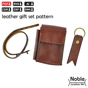 May include: A leather gift set pattern with a brown leather case, a leather strap, and a leather keychain. The case has a flap closure and stitched detailing. The keychain has a gold-colored ring and a rivet. The text "leather gift set pattern" is at the top.