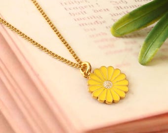 Handcrafted yellow daisy flower pendant in vibrant enamel