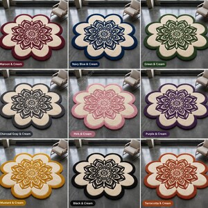 May include: A collection of nine flower-shaped area rugs, each featuring a central mandala-style pattern in various colors including maroon, navy blue, green, charcoal gray, pink, purple, mustard, black, and terracotta, all contrasted with cream.