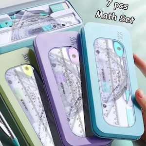 May include: A set of 7-piece math tools in a light blue, purple, and green metal case. The set includes rulers, protractors, and other geometric instruments. The text "7 pcs Math Set" is visible on the image.