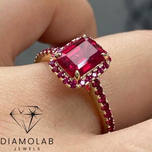 Emerald Cut Ruby Halo Engagement Ring: 14k Yellow Gold, Diamond Accents
