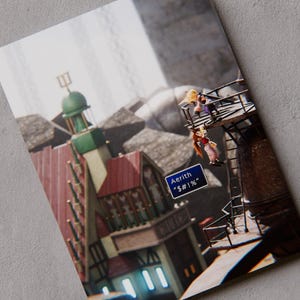 May include: A rectangular print featuring a stylized scene with a building that has a red roof and a green dome, alongside a metal structure with two figures. A blue sign in the foreground displays the text Aerith and symbols $#!%.