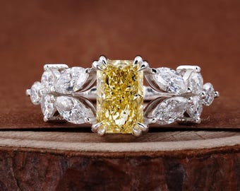 Nature-inspired yellow lab-grown diamond engagement ring with marquise leaf accents,
