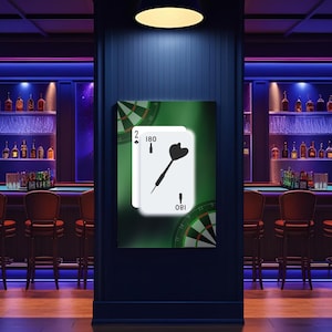 May include: A framed artwork depicting two playing cards with a dart and the numbers 2, 180, and 1. The artwork is set against a green gradient background, with a dartboard design on the sides. The scene is set in a bar with a dark blue wall.