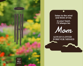 May include: A bronze wind chime hanging from a tree branch. The chime has several tubes and a wooden top. A small rectangular plaque at the bottom reads "Mom ALWAYS LOVED FOREVER MISSED". The image also includes text that reads "listen to the wind and think of me. In your heart, I'll always be."