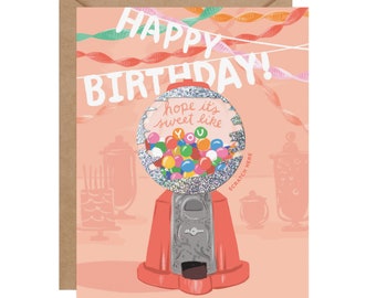 May include: A peach-colored birthday greeting card featuring a red gumball machine with a silver glitter globe. The text reads HAPPY BIRTHDAY! hope it's sweet like YOU and SCRATCH HERE. Colorful streamers and party silhouettes decorate the background.