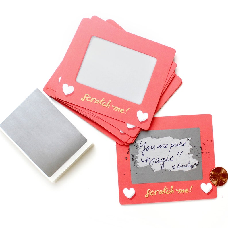 set of handmade scratch cards that have the "scratch me" phrase, pink frame, hearts image is the sweetest valentines day gift