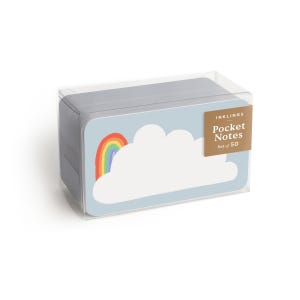 Op de afbeelding: Een transparante plastic doos met een set van 50 zaknotities met een regenboog- en wolkontwerp. De doos heeft een label met de tekst "Inkling's Pocket Notes Set of 50".