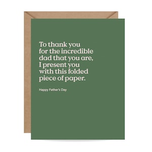 May include: A greeting card with a green front and a brown envelope. The card reads, "To thank you for the incredible dad that you are, I present you with this folded piece of paper. Happy Father's Day."