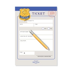 May include: A notepad designed as a police ticket, featuring a gold badge with the word "POLICE" and the text "TICKET." Includes fields for date, time, officer name, and violation, with a pencil resting on the page. The notepad is from "Tiny Town Goods."