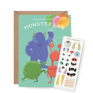 May include: A birthday card with a teal background featuring the text "MONSTER LAB" and illustrations of colorful monsters holding balloons. Includes a sheet of monster-themed stickers and a brown envelope.