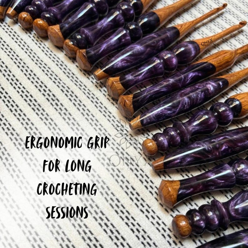 May include: A collection of handcrafted crochet hooks featuring polished wooden tips and ergonomic handles made from swirling purple and black resin. The text "ERGONOMIC GRIP FOR LONG CROCHETING SESSIONS" is printed on the left side of the image.