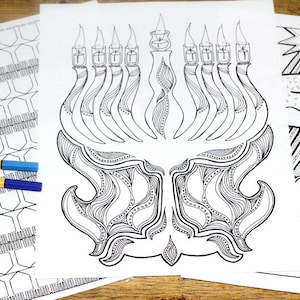 May include: A black and white printable coloring page featuring a detailed illustration of a menorah with seven candles. The menorah is decorated with intricate patterns and swirls.