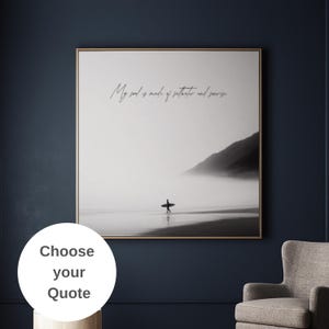 May include: Black and white framed wall art featuring a surfer walking on a beach with a surfboard. The artwork includes the quote, "My soul is made of saltwater and sunshine."