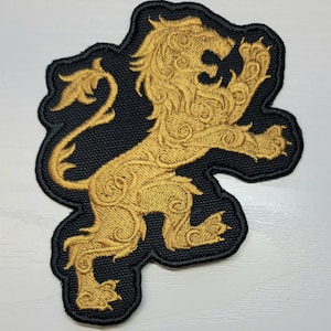Gilded lion embroidered patch