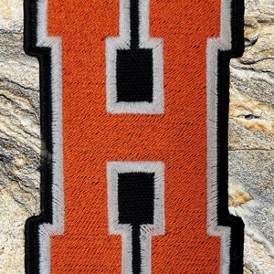 Letter H patch.
